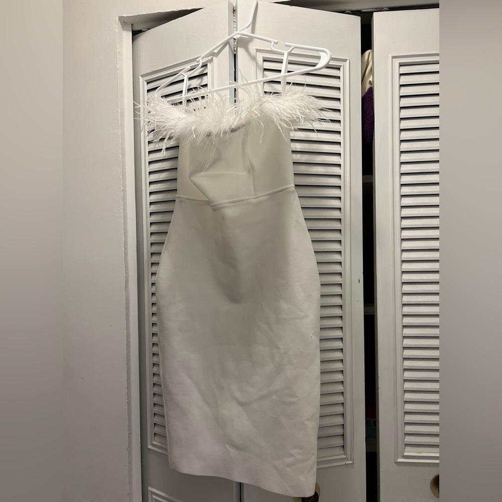 Never worn Medium white designer dress with feather trim neckline